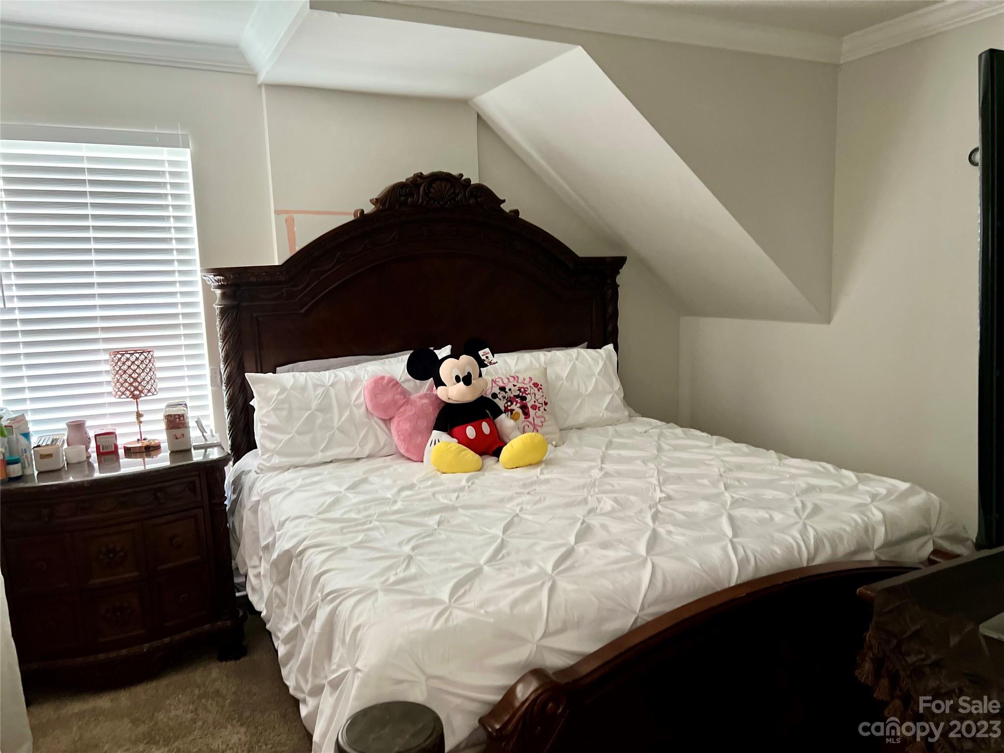 7018 Alanbrook Road Charlotte, NC 28215 - Photo 8 of 23 a bedroom with a bed and a closet