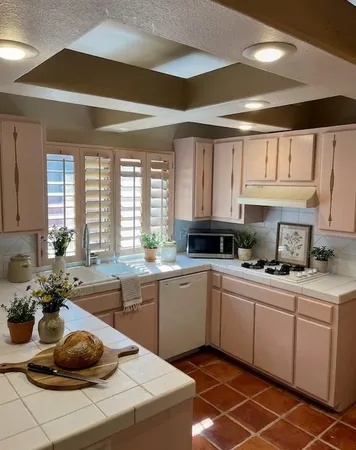 a kitchen with a sink and cabinets