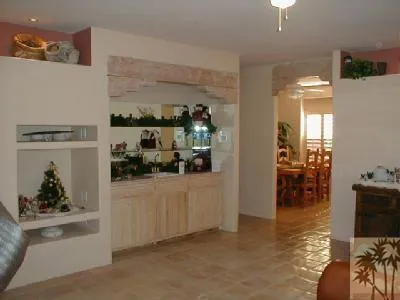 a kitchen with a table and chairs in it
