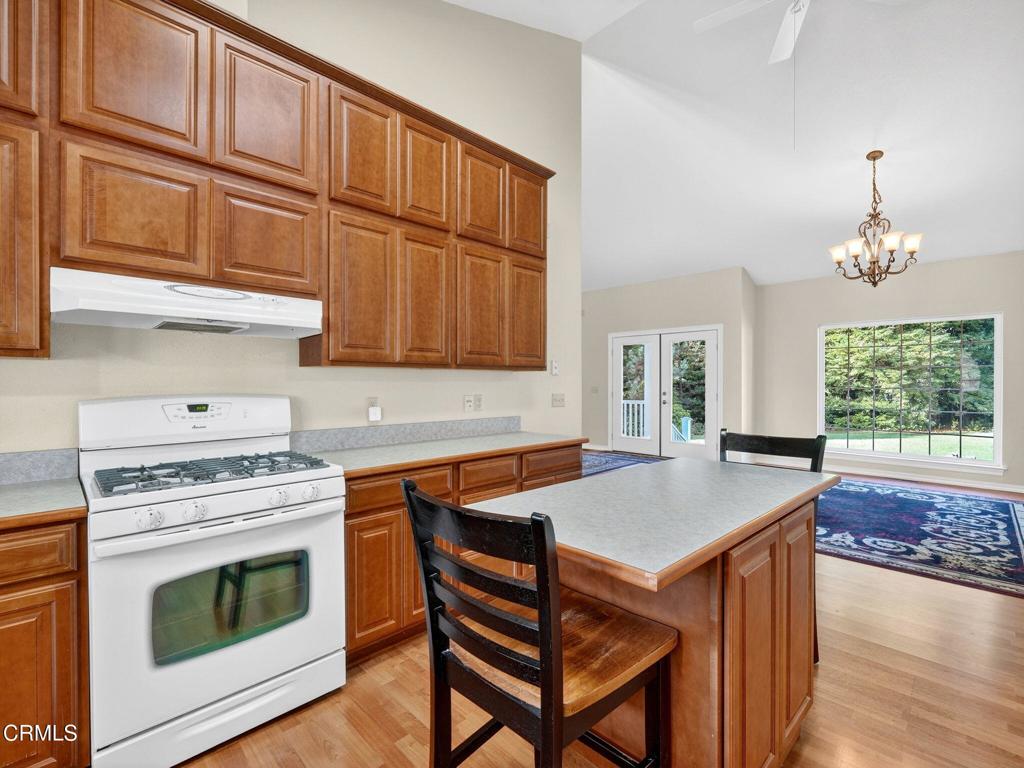 18970 Quail Lane Fort Bragg, CA 95437 - Photo 12 of 36 a kitchen with a stove a sink and a refrigerator