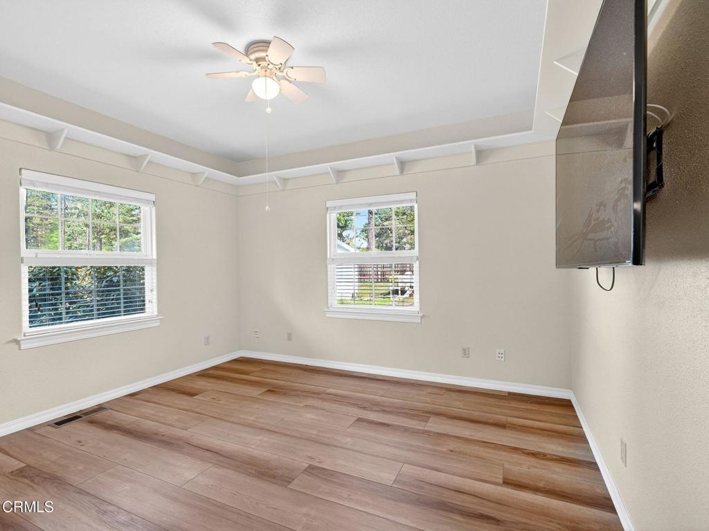 18970 Quail Lane Fort Bragg, CA 95437 - Photo 15 of 36 a view of a room with a ceiling fan and a window