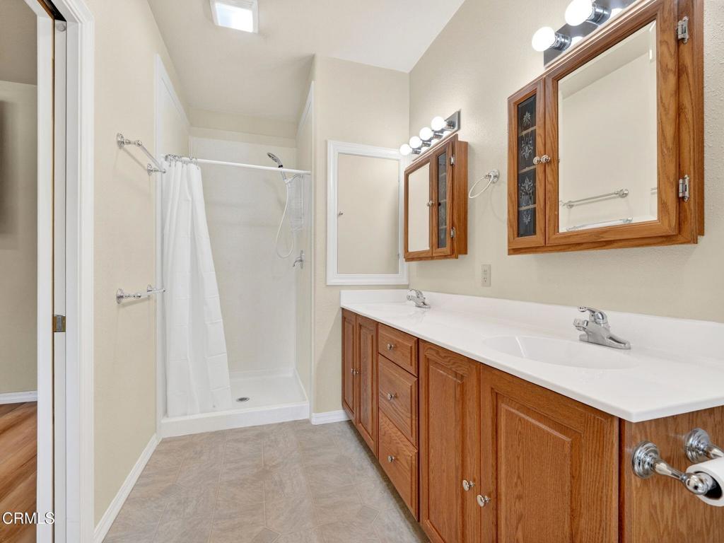 18970 Quail Lane Fort Bragg, CA 95437 - Photo 19 of 36 a bathroom with a double vanity sink mirror and