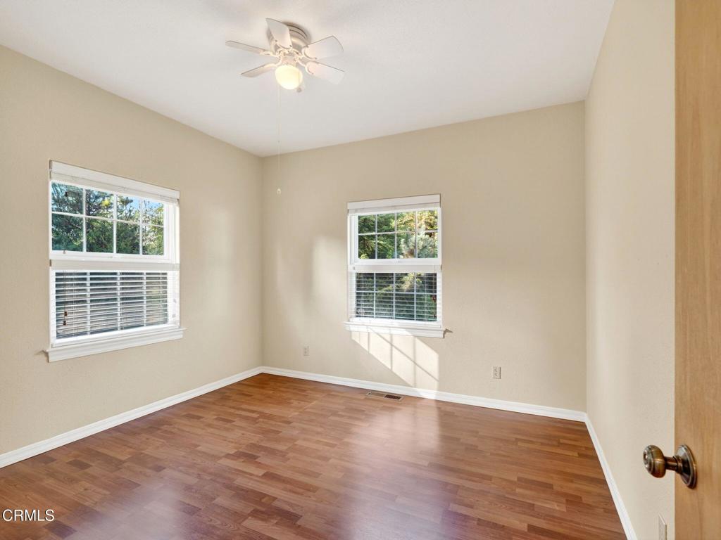 18970 Quail Lane Fort Bragg, CA 95437 - Photo 20 of 36 a view of an empty room with a window and wooden floor