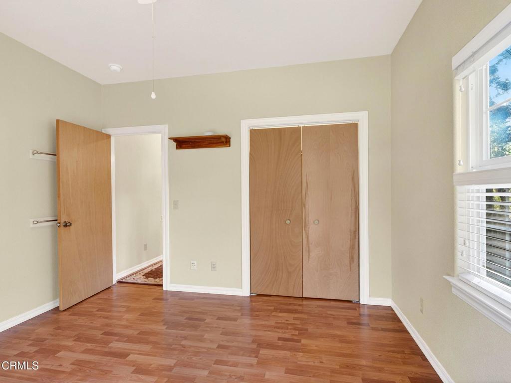 18970 Quail Lane Fort Bragg, CA 95437 - Photo 21 of 36 a view of an empty room with wooden floor and a window