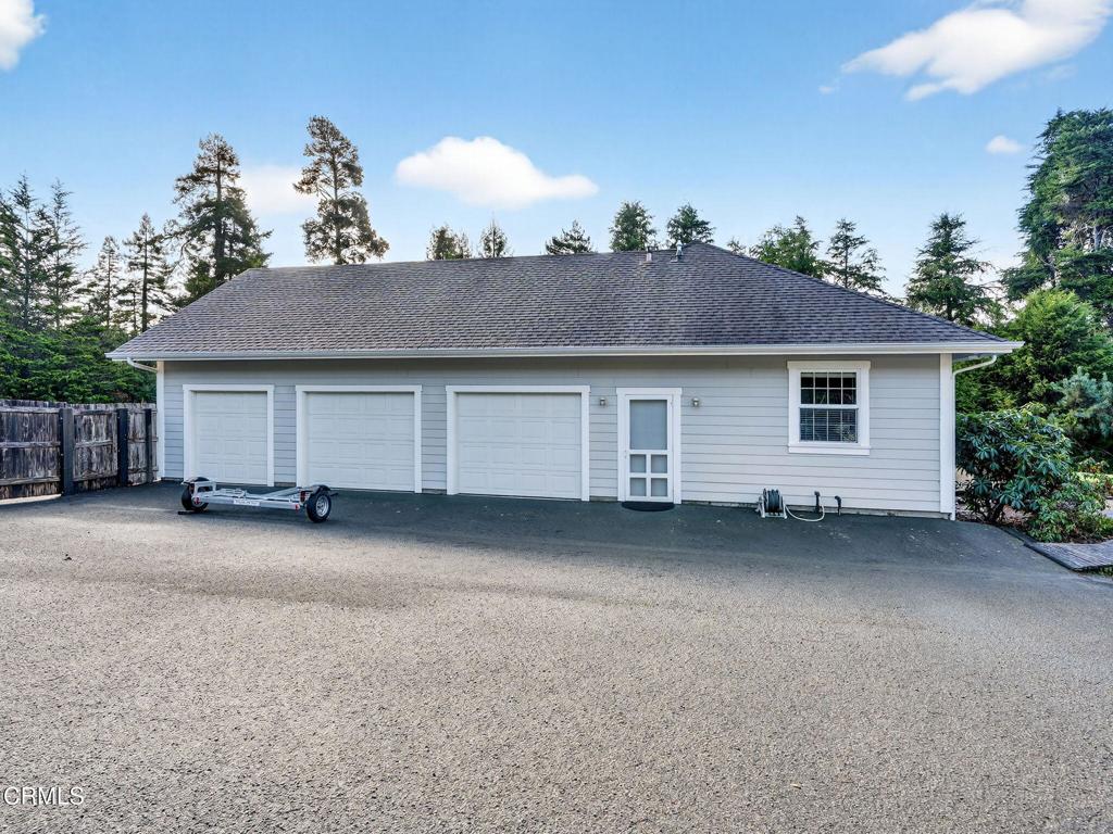 18970 Quail Lane Fort Bragg, CA 95437 - Photo 36 of 36 a view of a house with a yard and garage