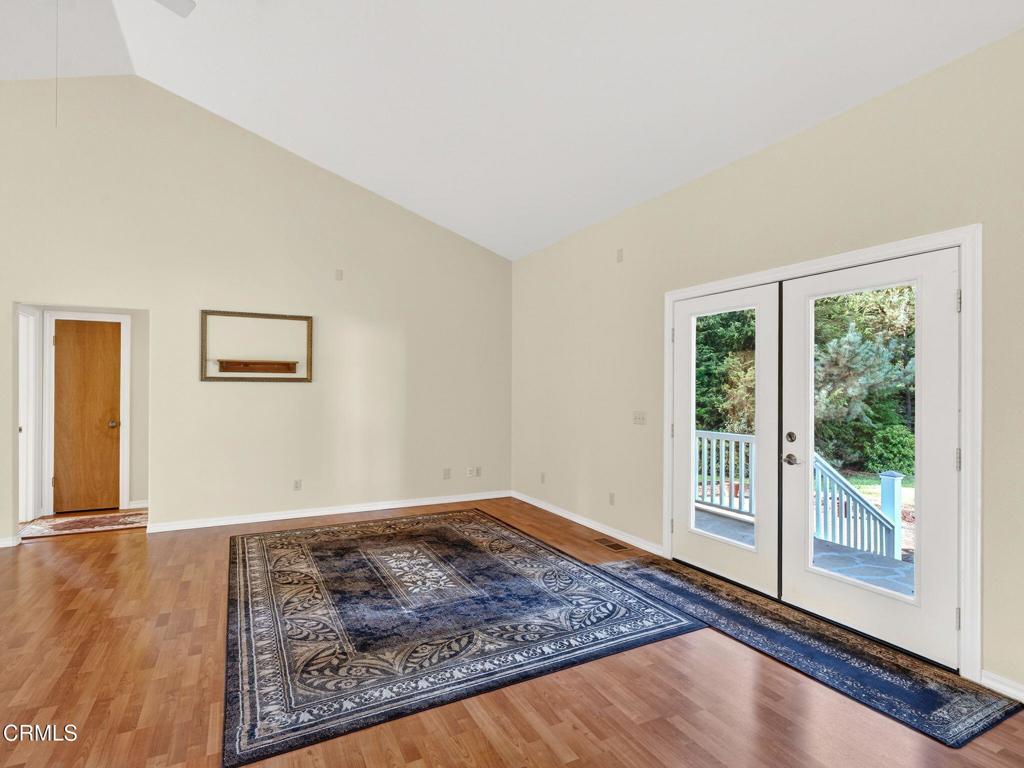 18970 Quail Lane Fort Bragg, CA 95437 - Photo 6 of 36 a view of a big room with wooden floor and windows