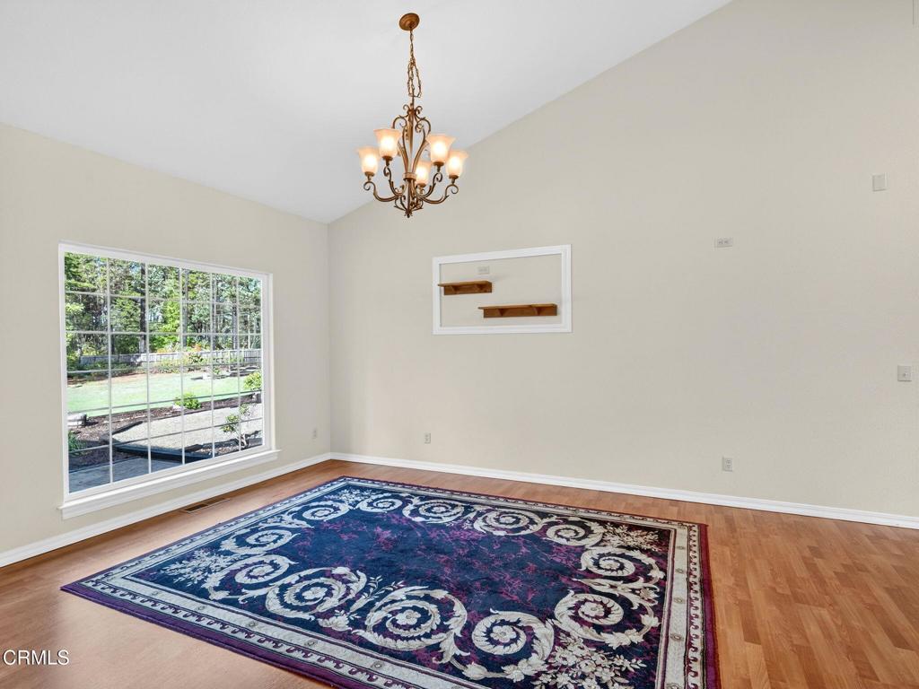 18970 Quail Lane Fort Bragg, CA 95437 - Photo 8 of 36 a view of a room with a chandelier and wooden floor