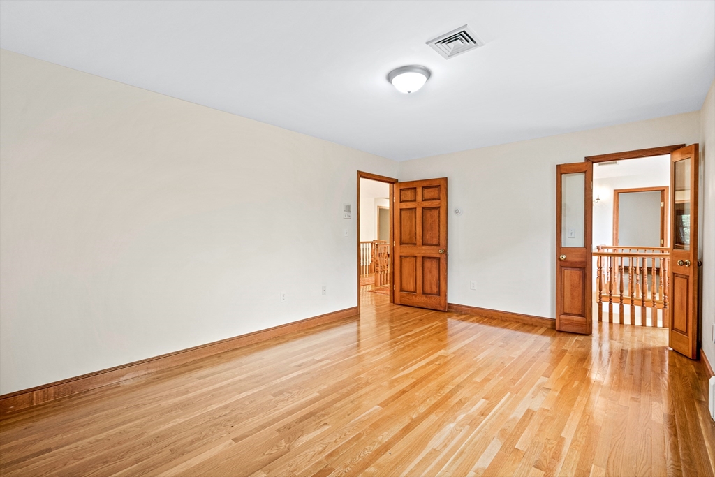 282 High Street Winchester, MA 01890 - Photo 17 of 26 a view of an empty room with wooden floor and a window