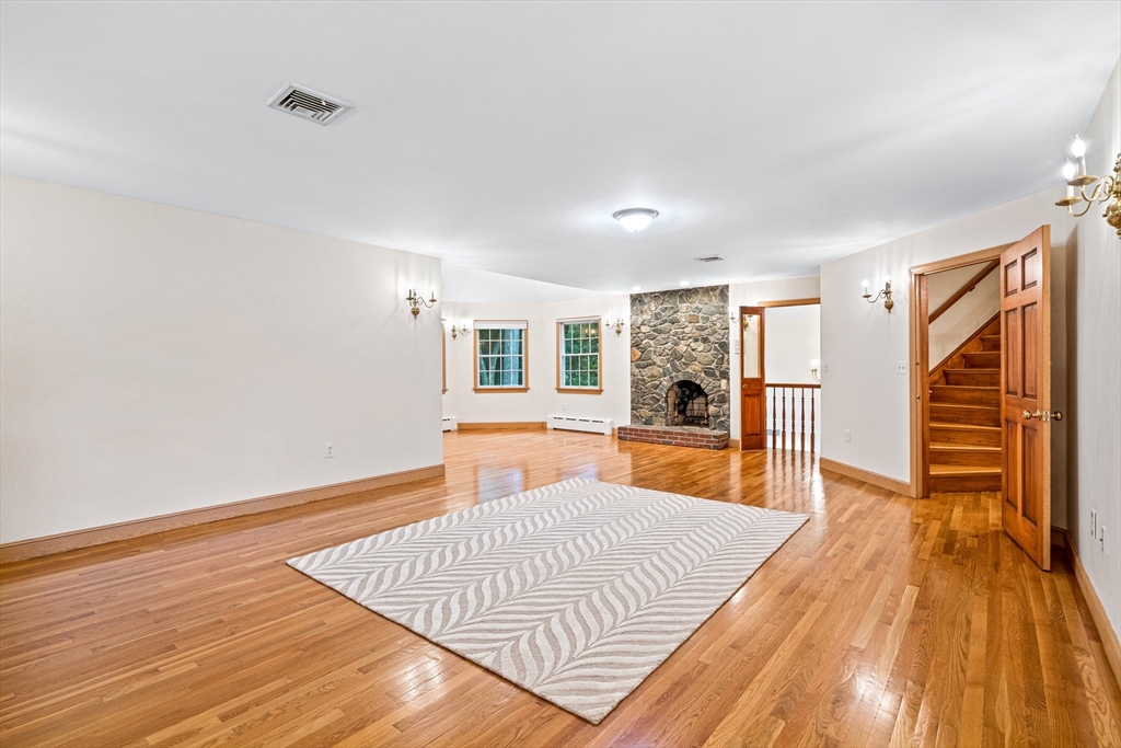 282 High Street Winchester, MA 01890 - Photo 18 of 26 a bedroom with wooden floor and window