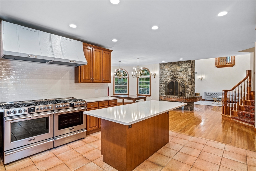 282 High Street Winchester, MA 01890 - Photo 9 of 26 a kitchen with stainless steel appliances granite countertop a stove and a sink