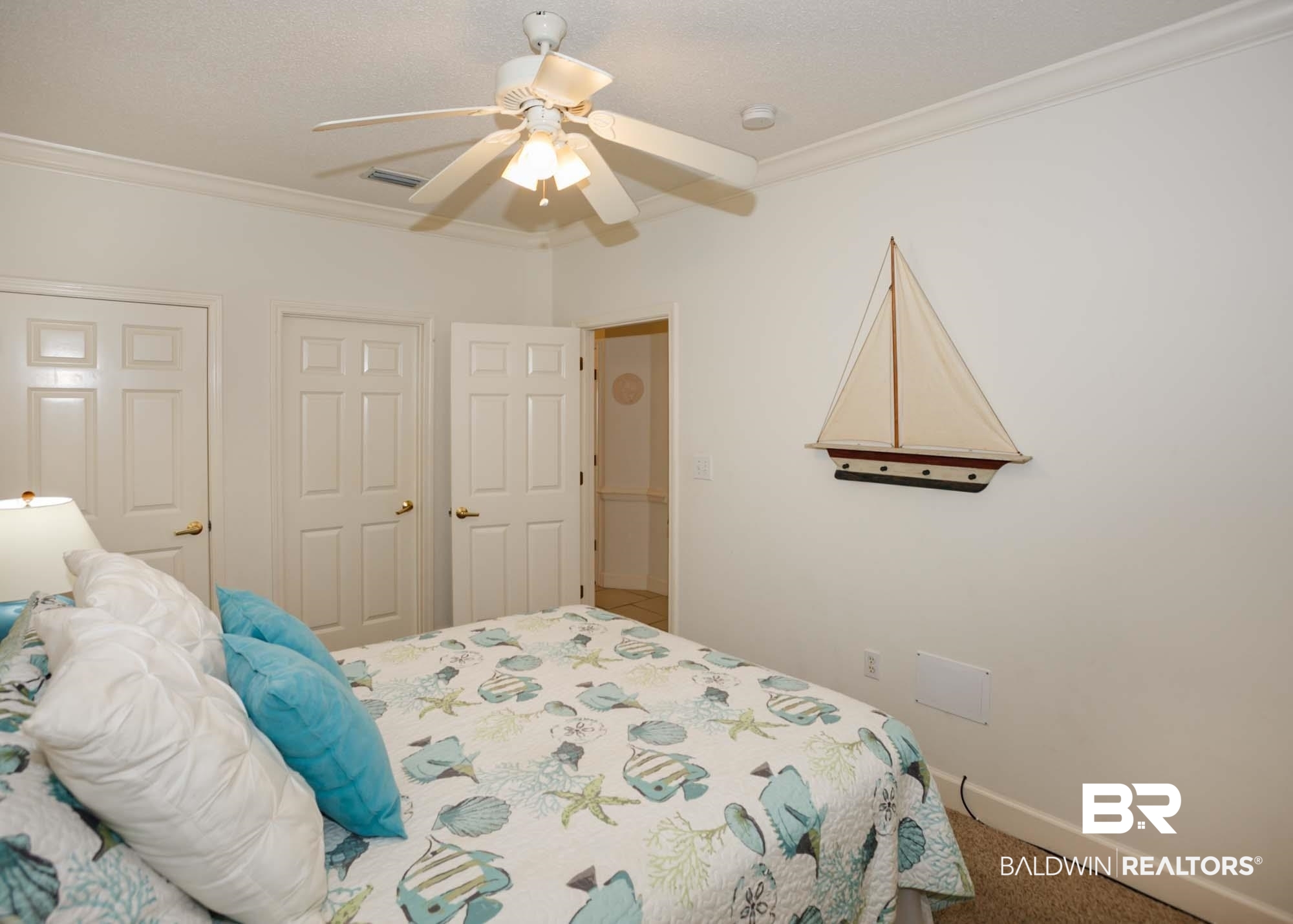 28910 Perdido Beach Boulevard, Unit 4B Orange Beach, AL 36561 - Photo 29 of 48 Carpeted bedroom with baseboards, ceiling fan, visible vents, and crown molding