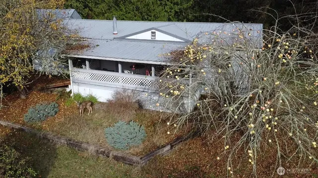 a aerial view of a house with a yard