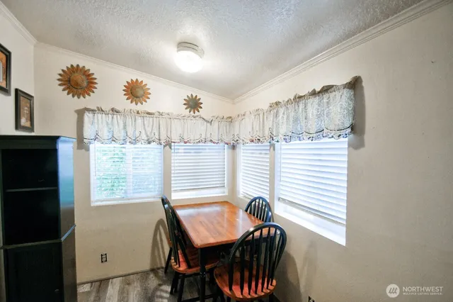 a view of a room with furniture and windows