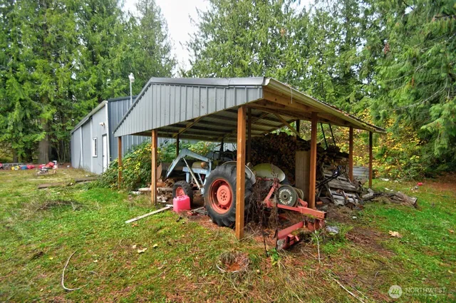 an outdoor space with furniture and garden