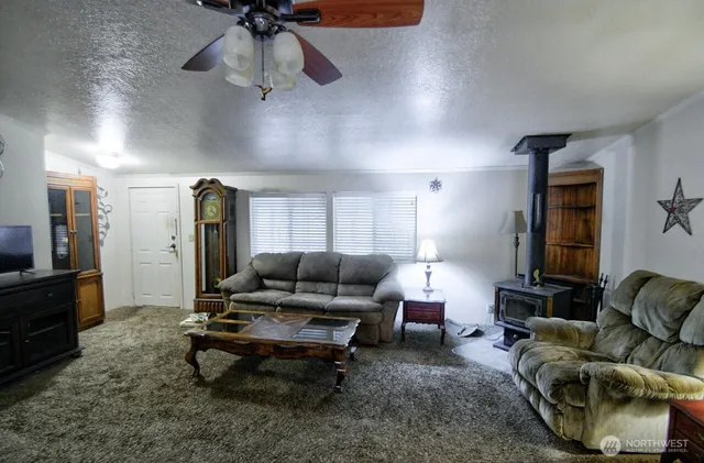 a living room with furniture and a rug