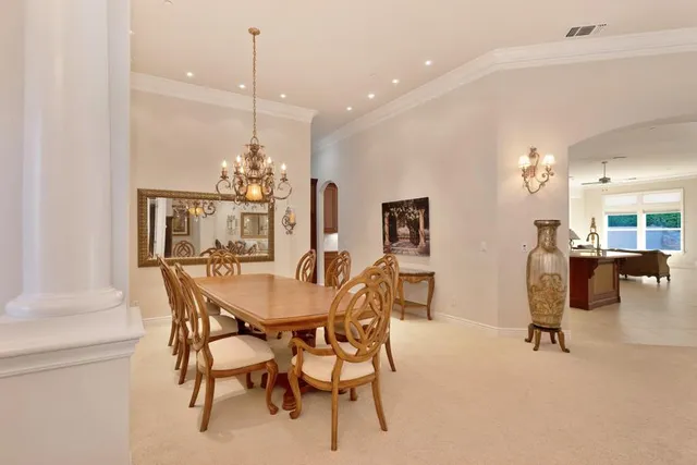 a kitchen with granite countertop a stove and a refrigerator