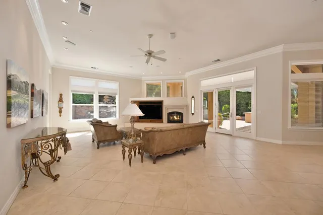 a large kitchen with a table and chairs