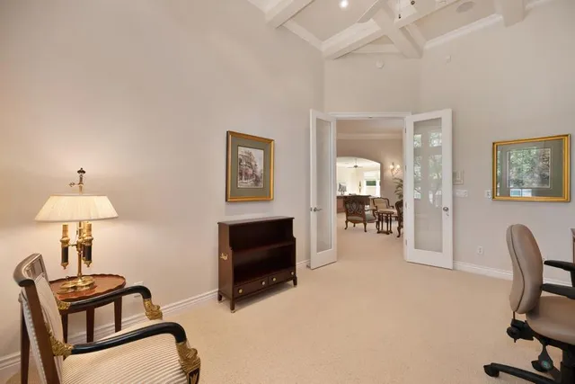 a bedroom with a bed couch and window