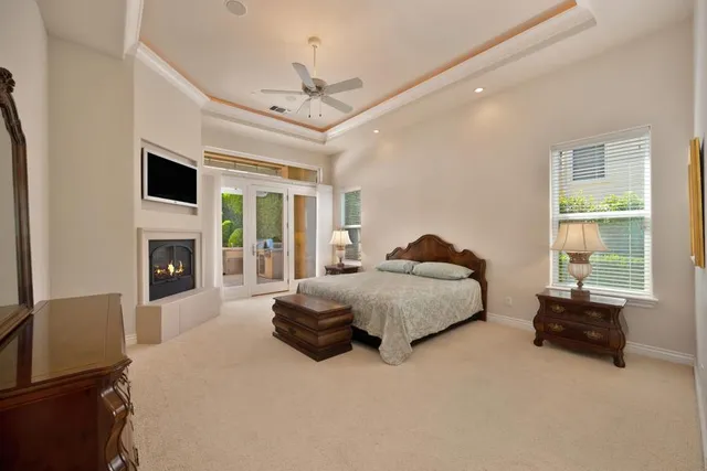 a view of an empty room with a ceiling fan