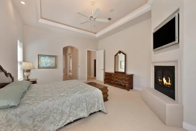 a bathroom with a double vanity sink mirror and toilet