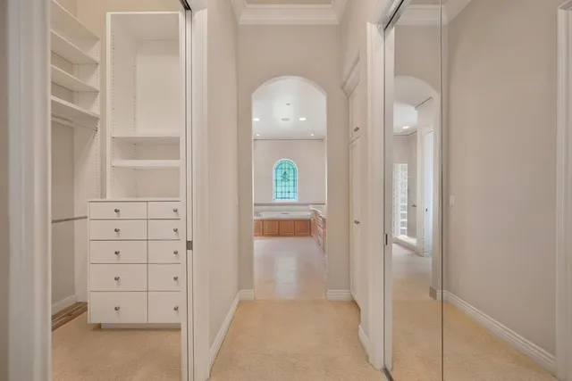 a view of a patio with a table and chairs and potted plants
