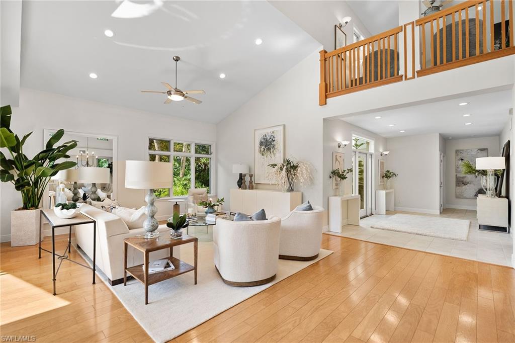 416 3rd Avenue North Naples, FL 34102 - Photo 12 of 50 a living room with furniture and a table