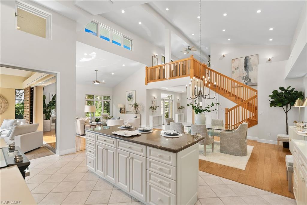 416 3rd Avenue North Naples, FL 34102 - Photo 22 of 50 a large room with mirror and furniture