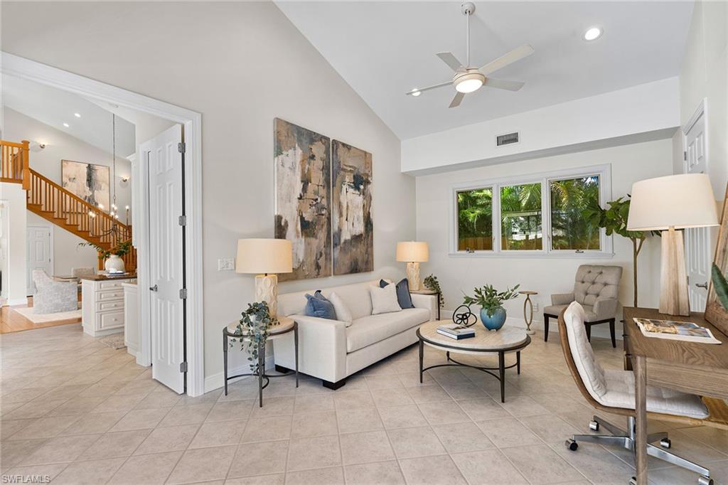 416 3rd Avenue North Naples, FL 34102 - Photo 23 of 50 a living room with furniture and a large window