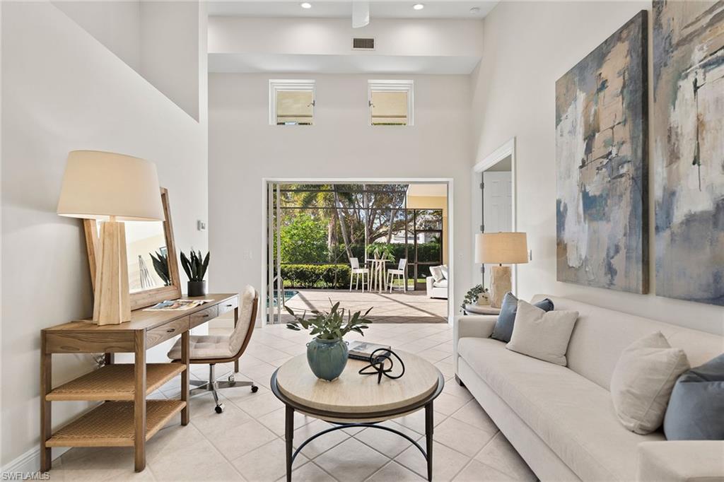 416 3rd Avenue North Naples, FL 34102 - Photo 24 of 50 a living room with furniture and a window