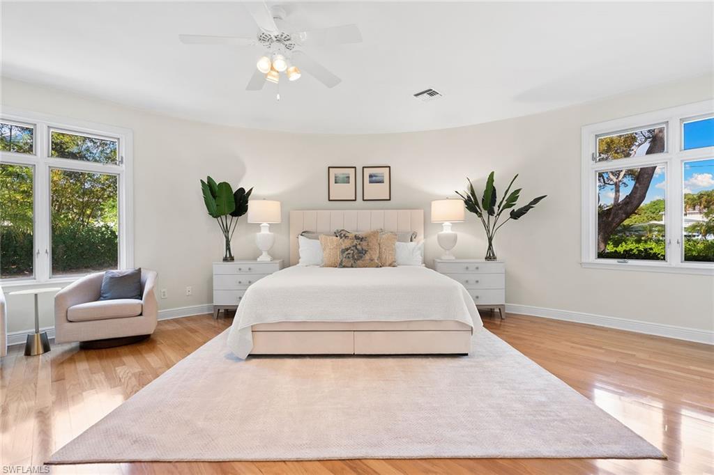 416 3rd Avenue North Naples, FL 34102 - Photo 26 of 50 a bedroom with a large bed and a couch