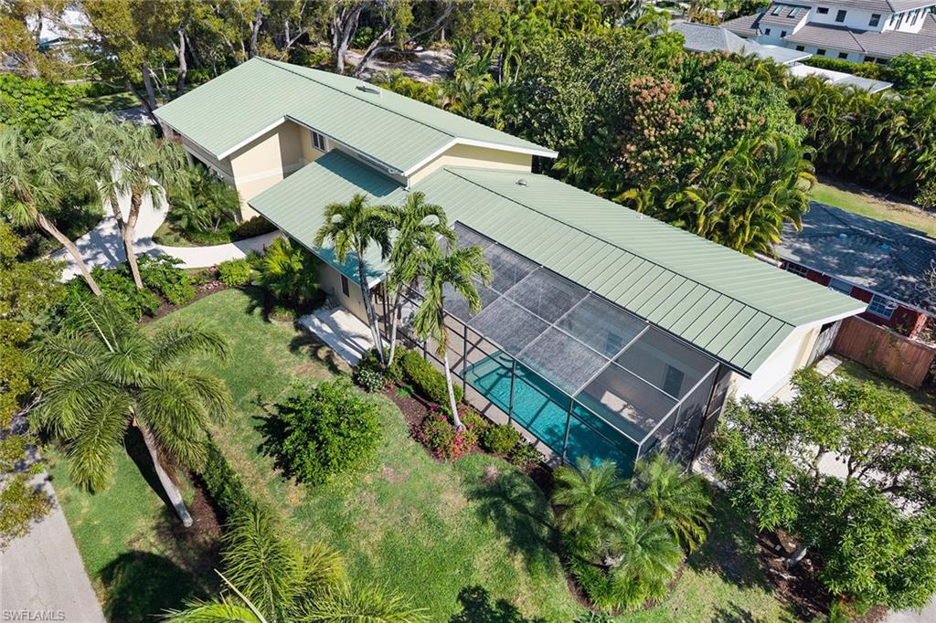 416 3rd Avenue North Naples, FL 34102 - Photo 3 of 50 a view of a garden with a house