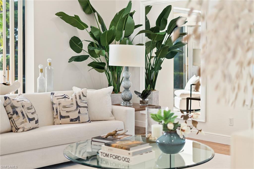 416 3rd Avenue North Naples, FL 34102 - Photo 31 of 50 a living room with furniture potted plant and wooden floor