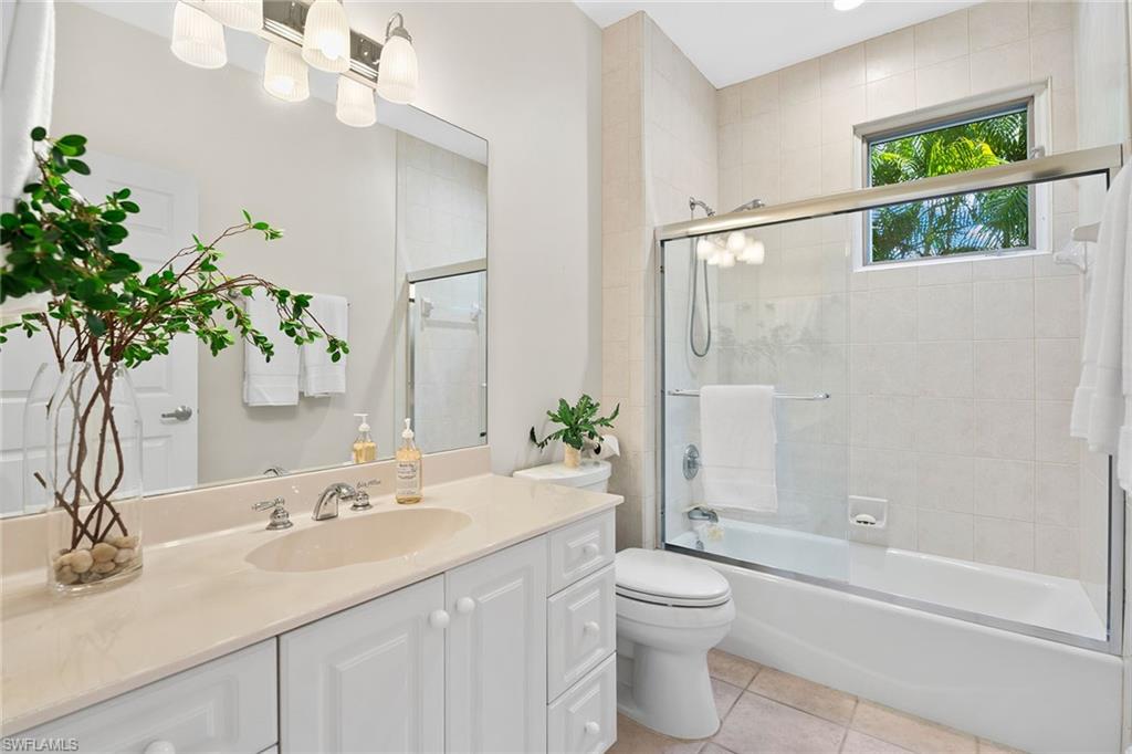 416 3rd Avenue North Naples, FL 34102 - Photo 33 of 50 a bathroom with a granite countertop sink a toilet and shower