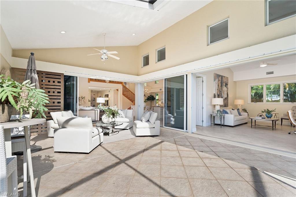 416 3rd Avenue North Naples, FL 34102 - Photo 39 of 50 a living room with furniture and a potted plant