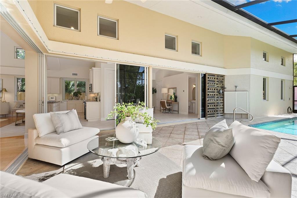 416 3rd Avenue North Naples, FL 34102 - Photo 40 of 50 a living room with furniture and dining table