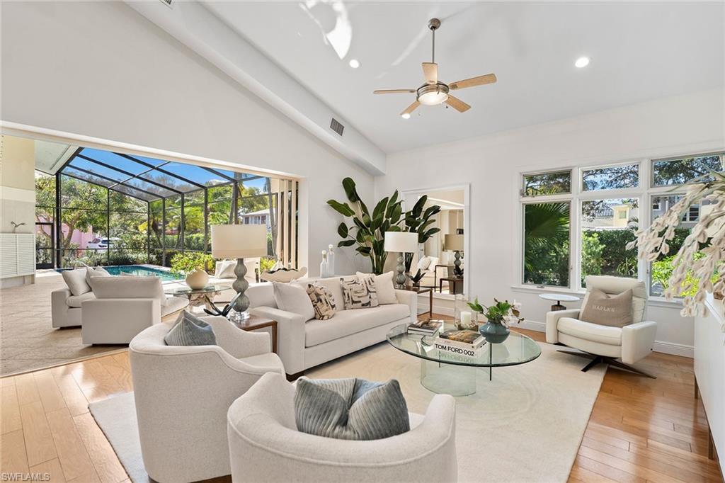 416 3rd Avenue North Naples, FL 34102 - Photo 4 of 50 a living room with furniture and a large window