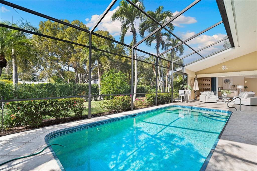 416 3rd Avenue North Naples, FL 34102 - Photo 42 of 50 a view of a house with backyard and sitting area