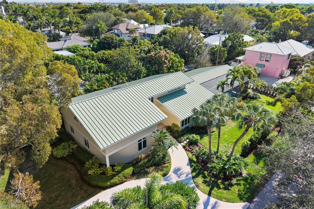 416 3rd Avenue North Naples, FL 34102 - Photo 45 of 50 an aerial view of a house with a yard and garden
