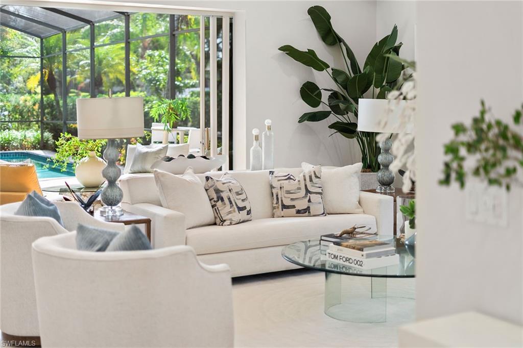 416 3rd Avenue North Naples, FL 34102 - Photo 5 of 50 a living room with furniture potted plant and a large window