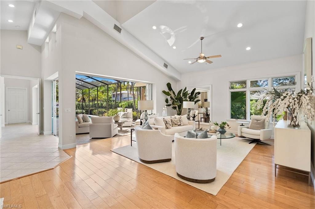 416 3rd Avenue North Naples, FL 34102 - Photo 6 of 50 a living room with furniture and a large window