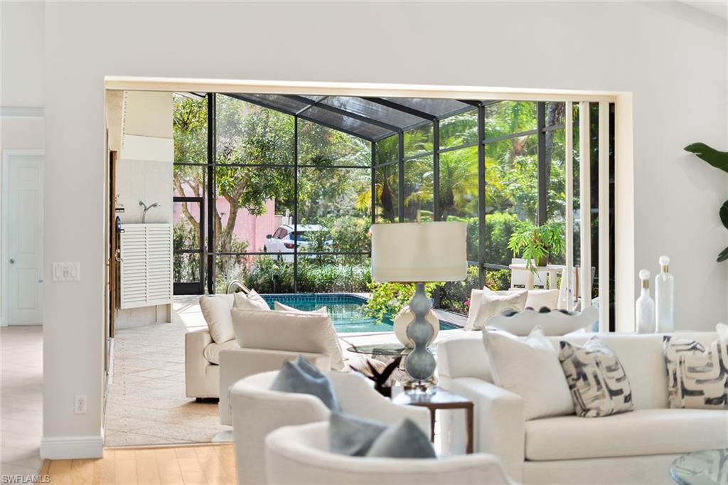 416 3rd Avenue North Naples, FL 34102 - Photo 7 of 50 a living room with furniture and a large window