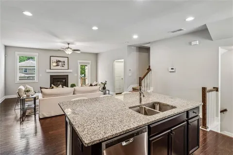 a kitchen with a stove a sink and a refrigerator
