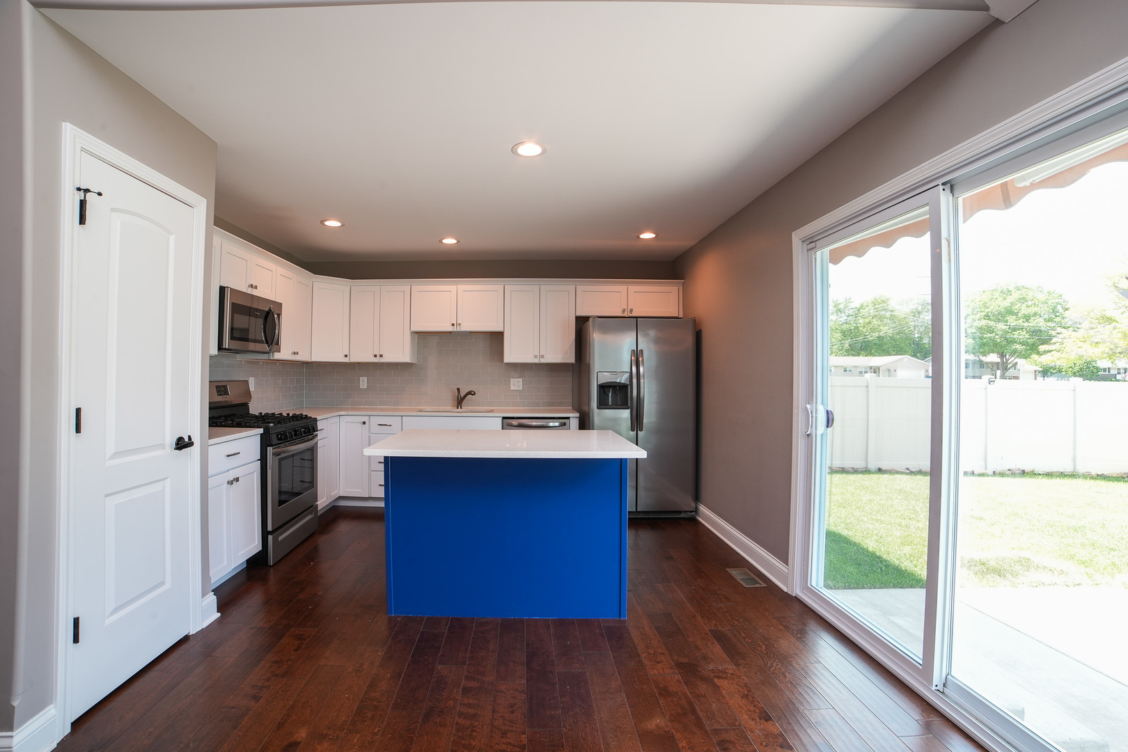 282 Patton Turn Bradley, IL 60915 - Photo 12 of 37 a open kitchen with kitchen island wooden floors and stainless steel appliances