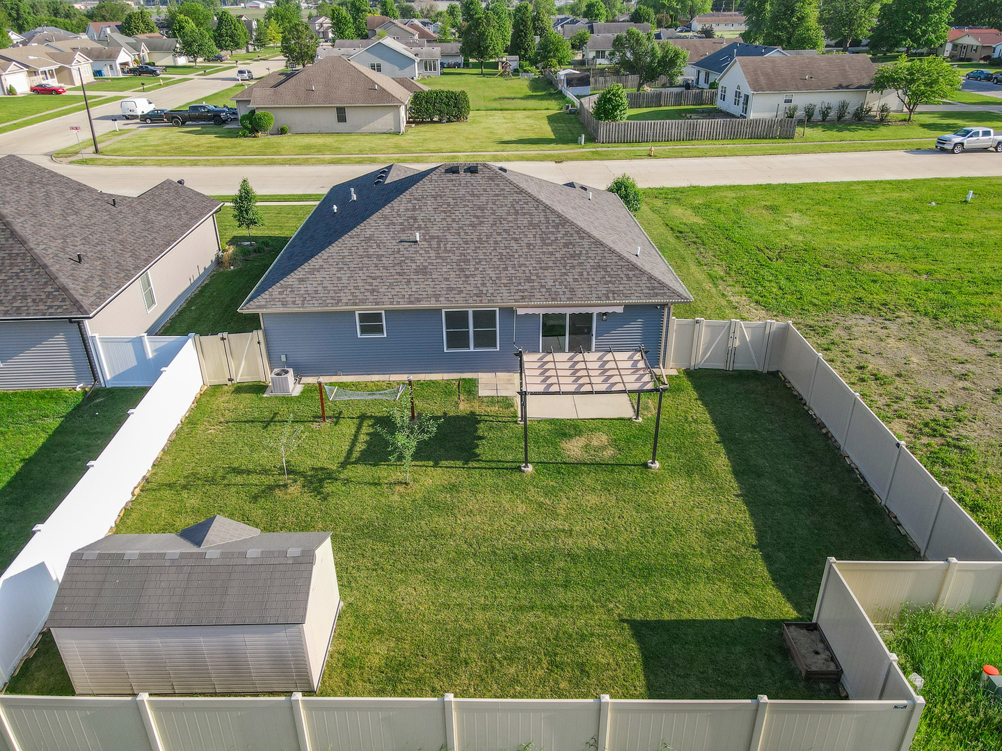 282 Patton Turn Bradley, IL 60915 - Photo 35 of 37 a aerial view of a house with swimming pool lawn chairs and a fire pit