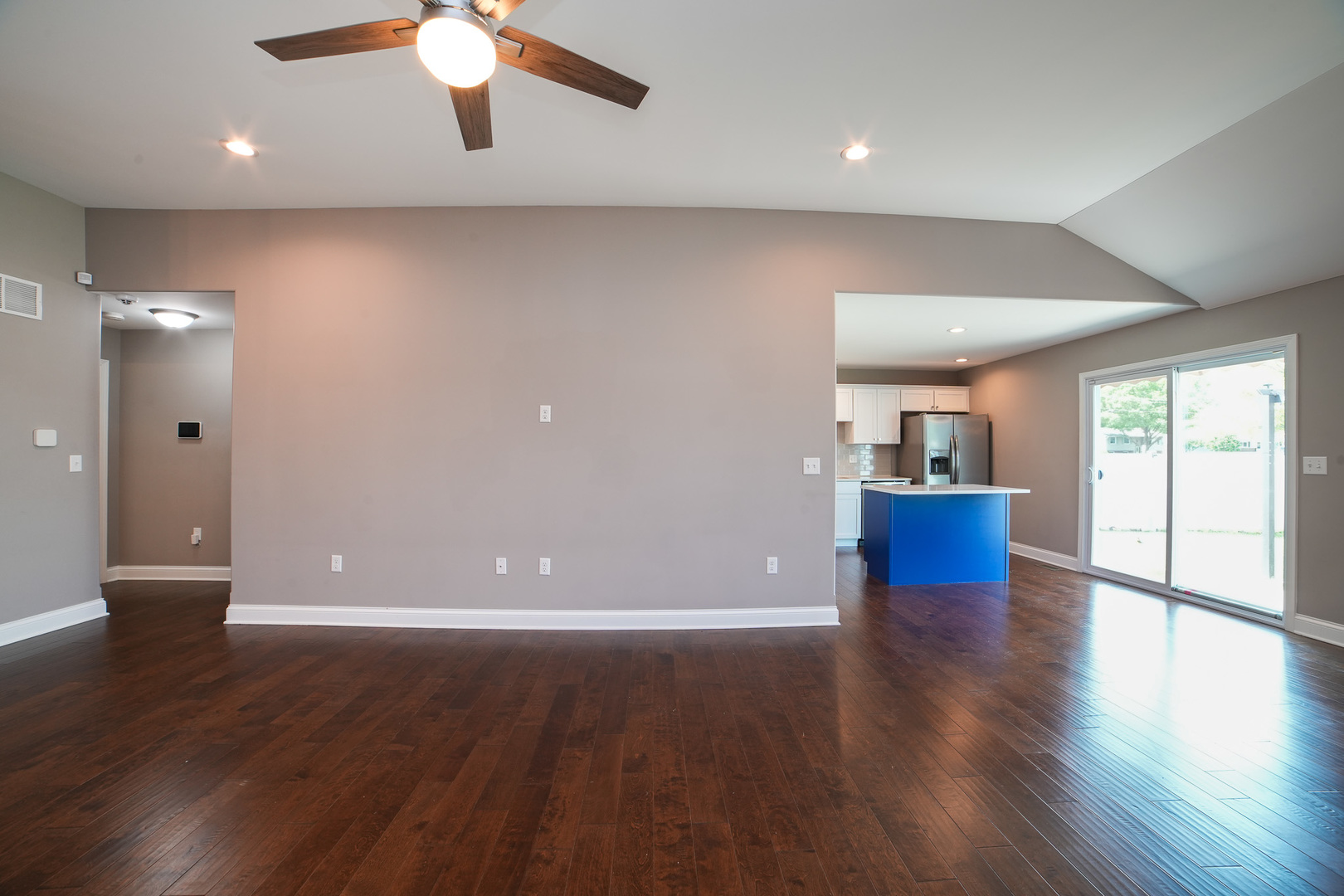 282 Patton Turn Bradley, IL 60915 - Photo 7 of 37 a view of a livingroom with wooden floor and a ceiling fan