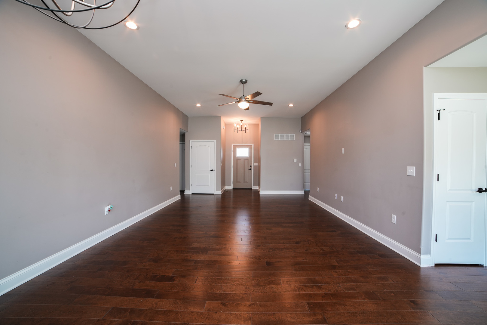 282 Patton Turn Bradley, IL 60915 - Photo 10 of 37 an empty room with wooden floor and staircase