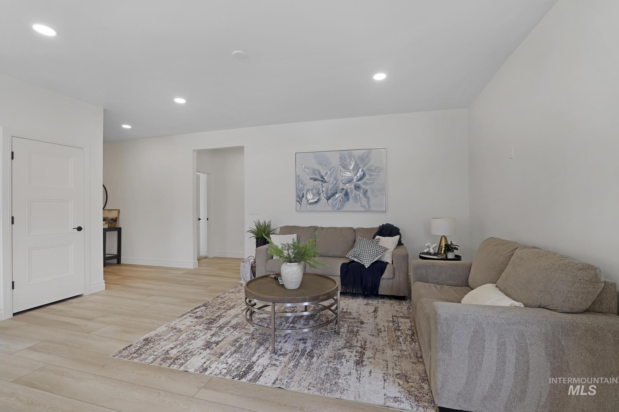 866 Quartz Road Kimberly, ID 83341 - Photo 10 of 48 Living area featuring light wood-finish flooring, recessed lighting, and white baseboards