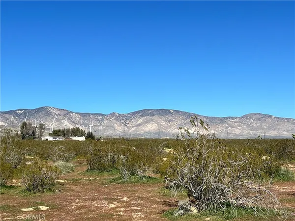 a view of a mountain with lake view