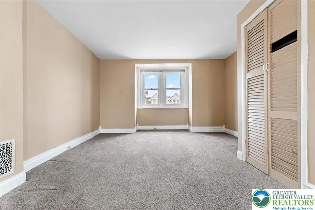 an empty room with windows