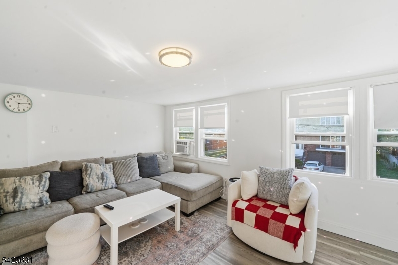 60 Westervelt Place Lodi, NJ 07644 - Photo 10 of 48 a living room with furniture and windows